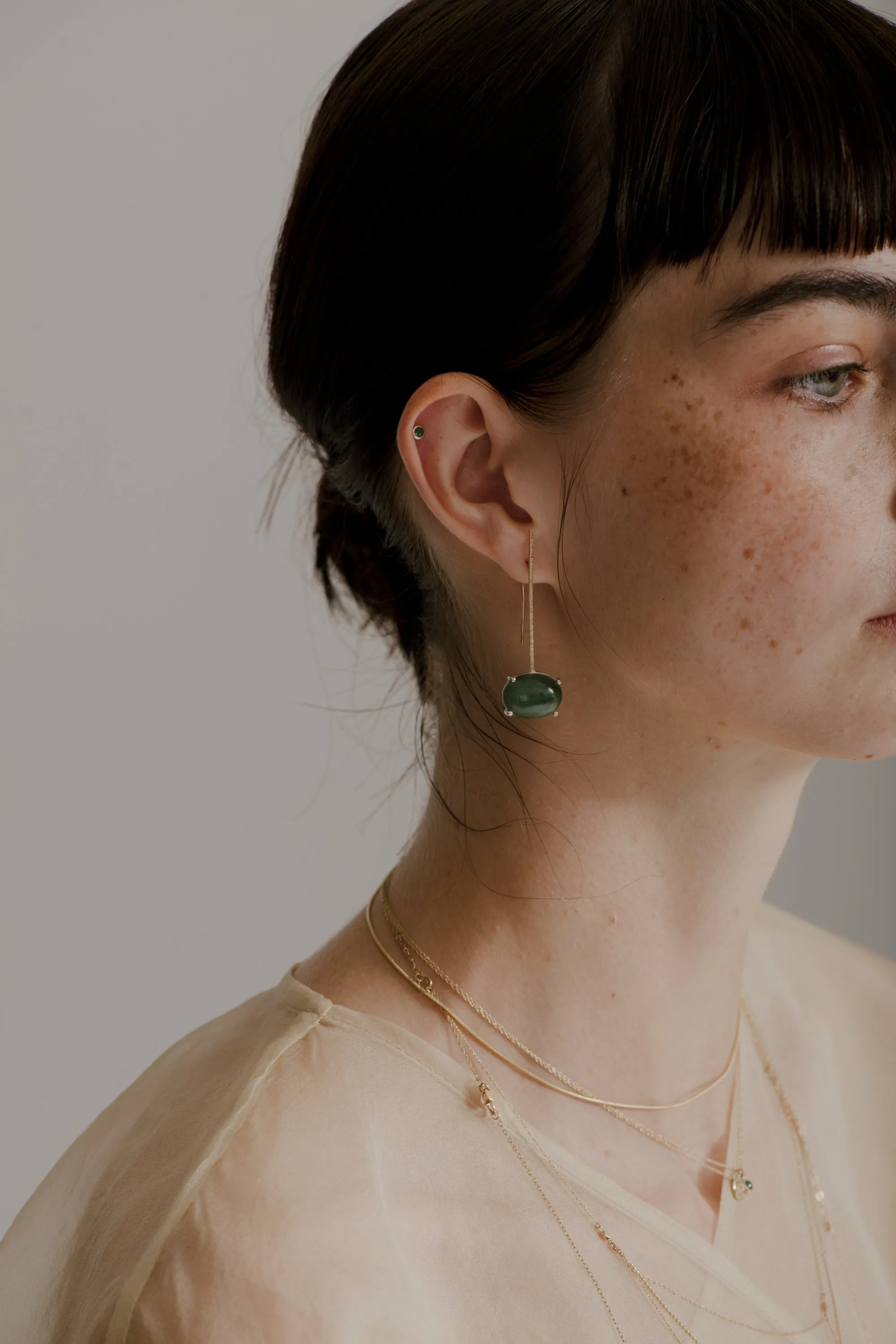 emerald bezel stud