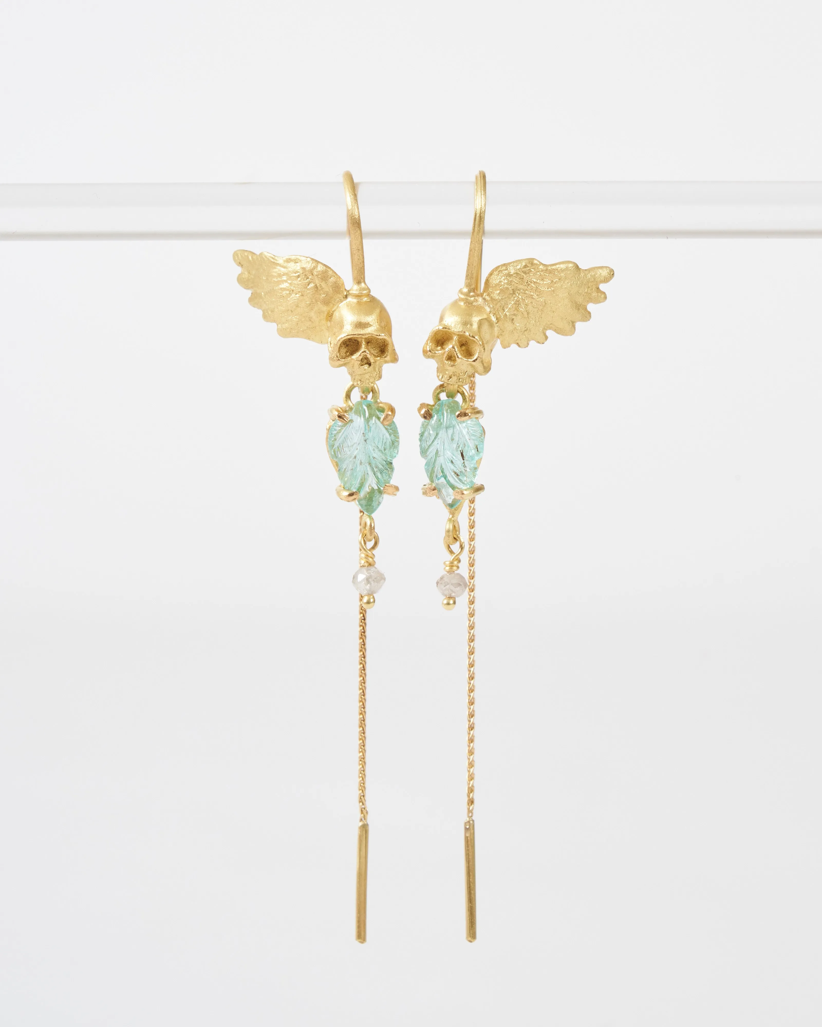 emerald skull earrings