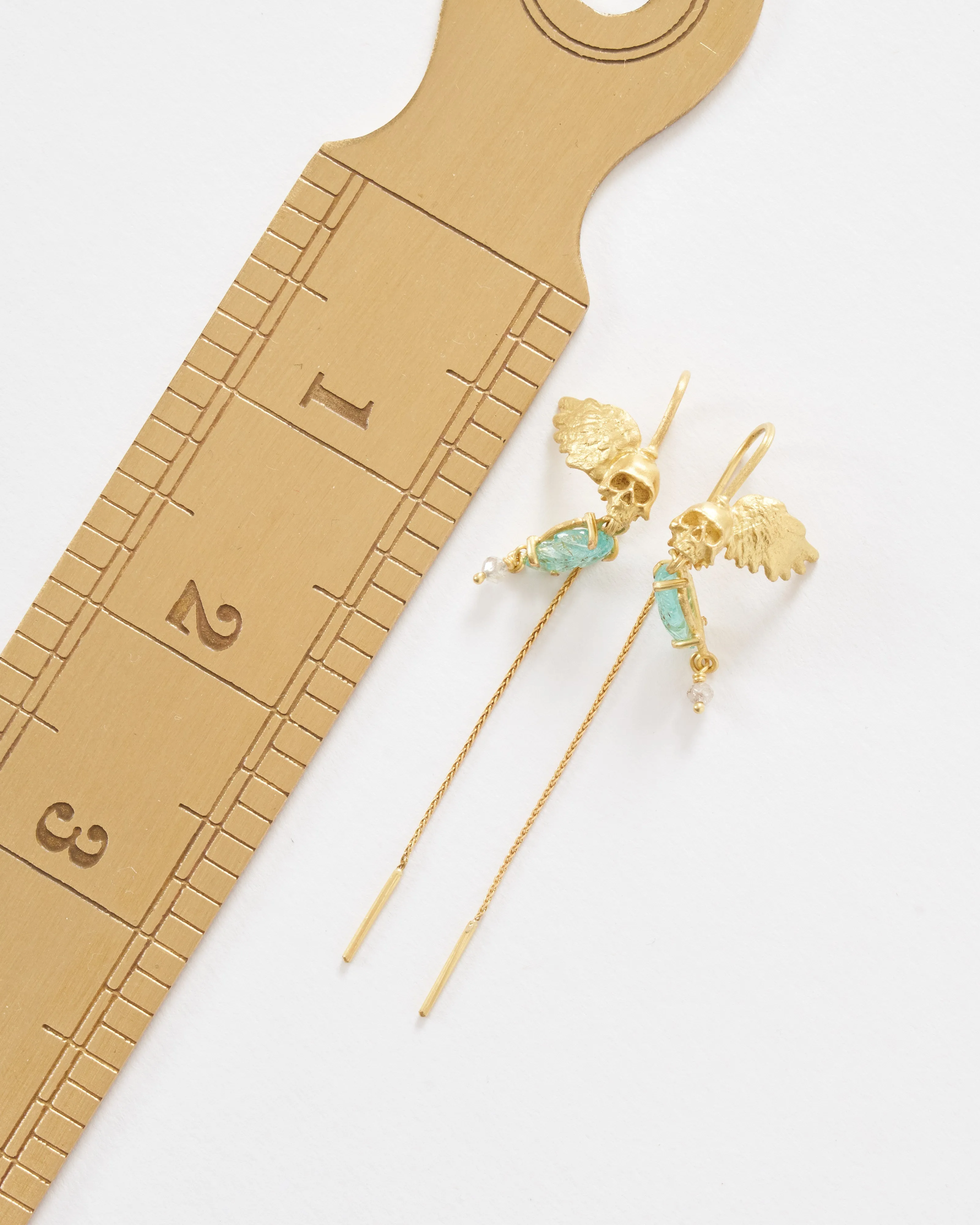 emerald skull earrings