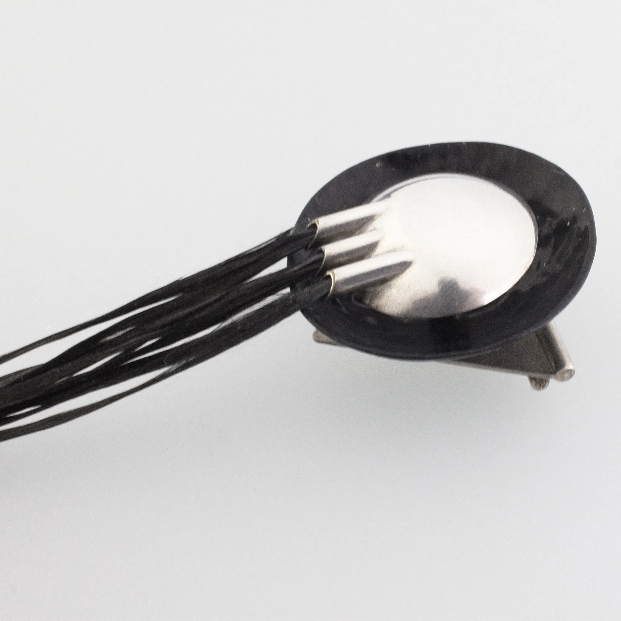 'FLARING' handmade sterling silver brooch with black carbon fibre