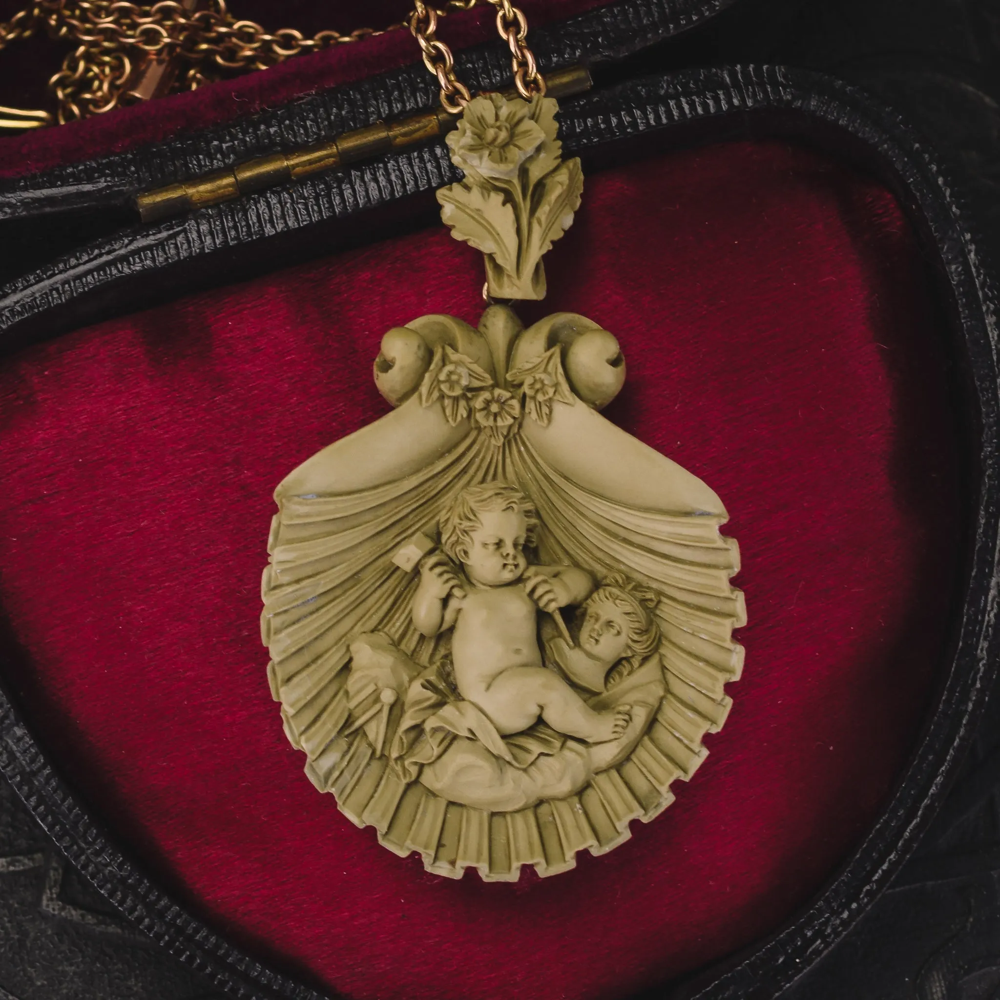 Mid-Victorian "Cupid Carving Aphrodite" Lava Cameo Pendant