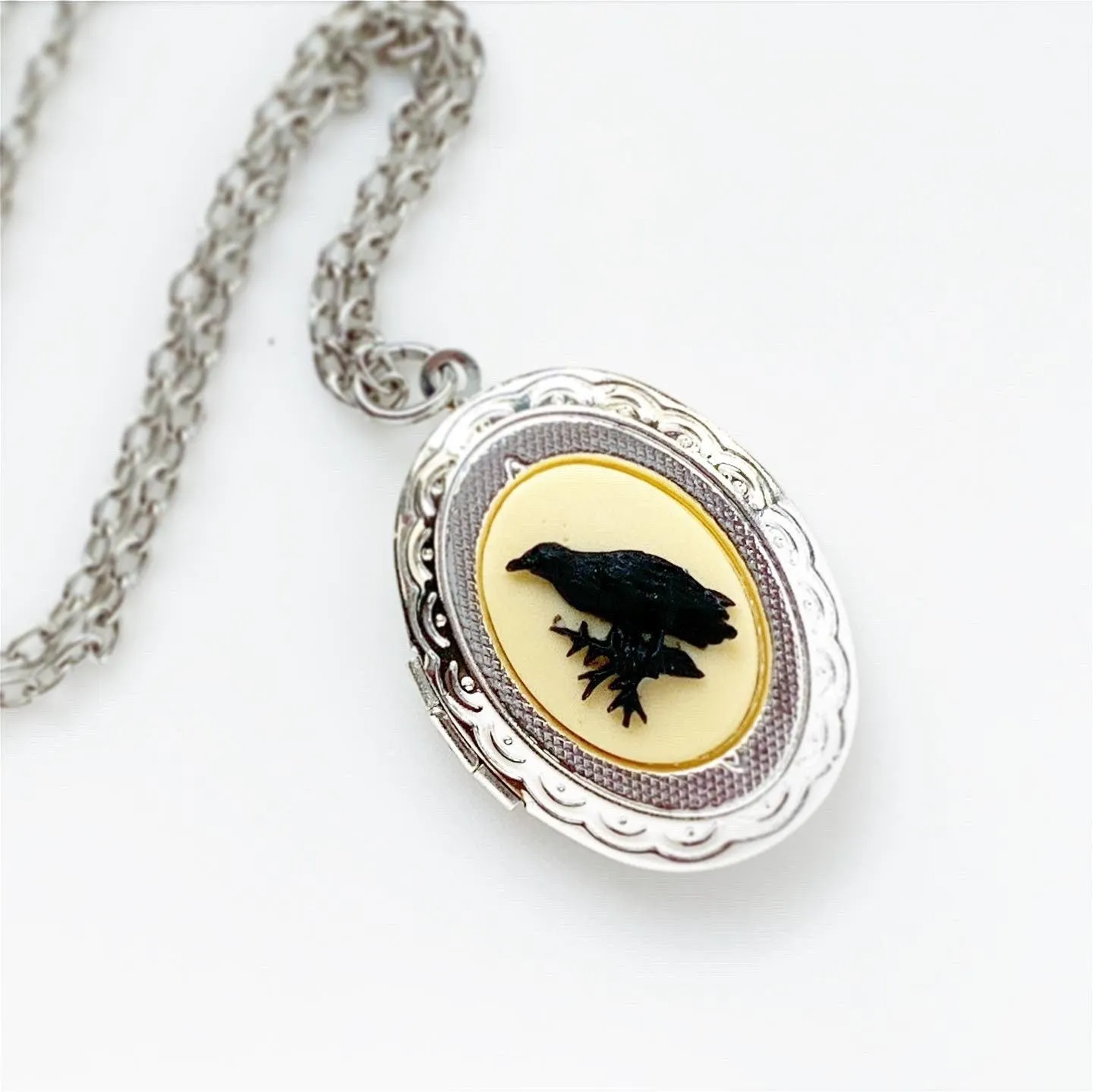 Raven Cameo Locket Necklace in Silver