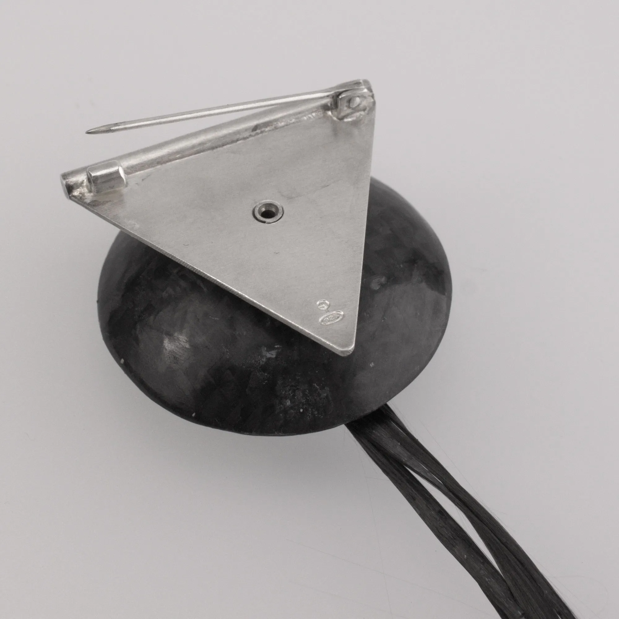 'REVEAL' handcrafted sterling silver brooch with black carbon fibre