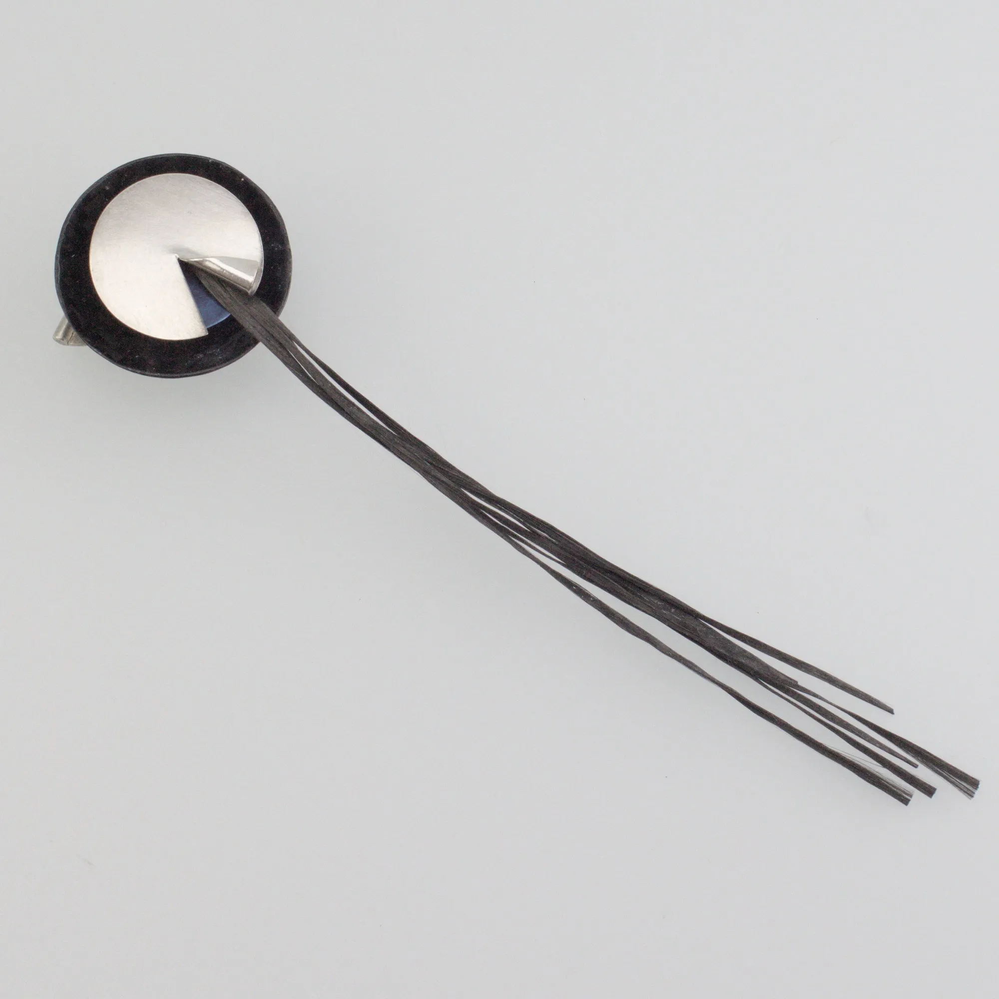 'REVEAL' handcrafted sterling silver brooch with black carbon fibre