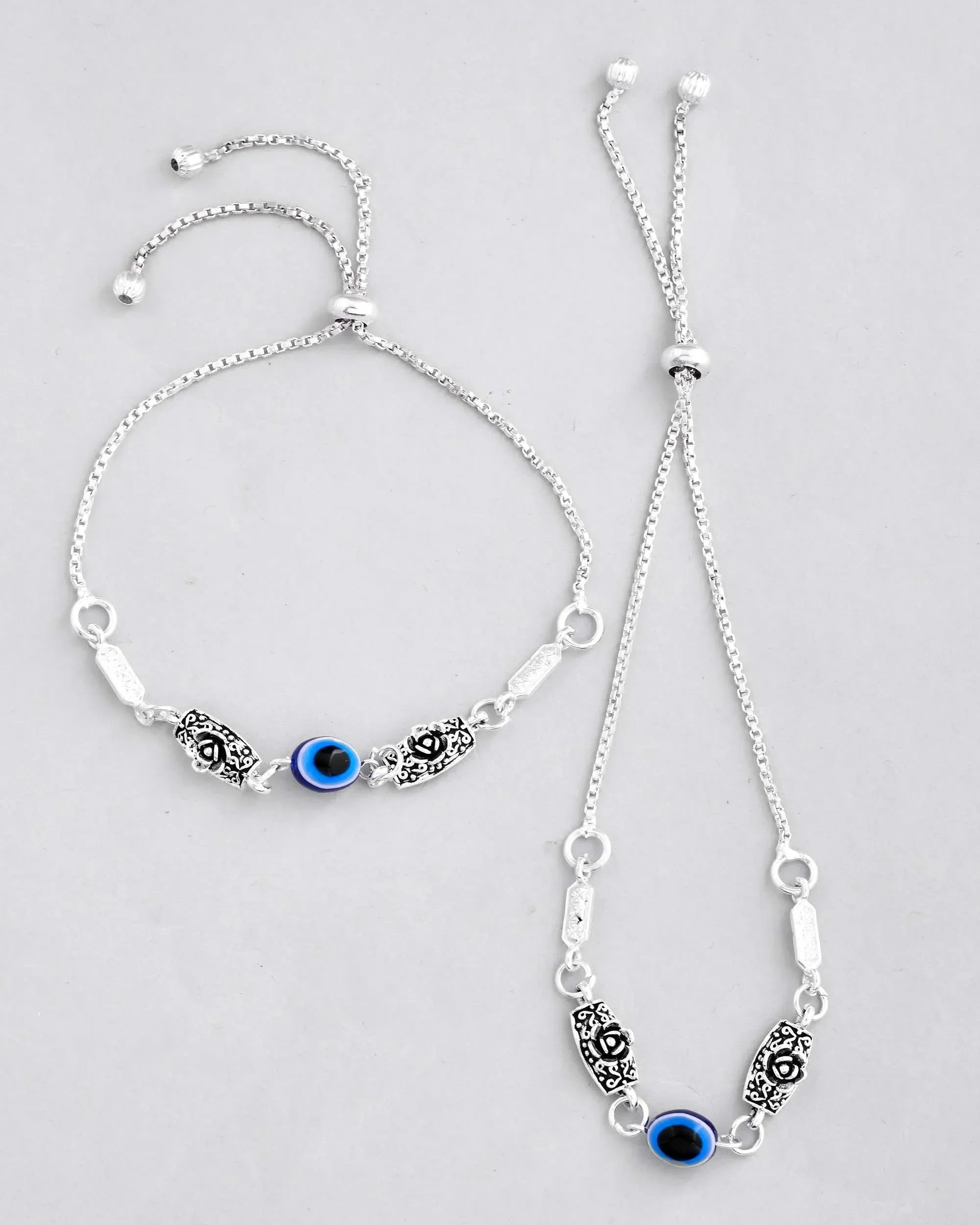 Set Of 2 Silver Plated Flower And Evil Eye HandCrafted Anklet-VOJ407